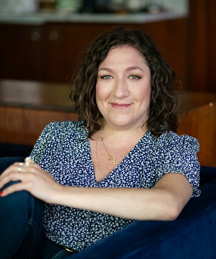 Harper Spero, seated