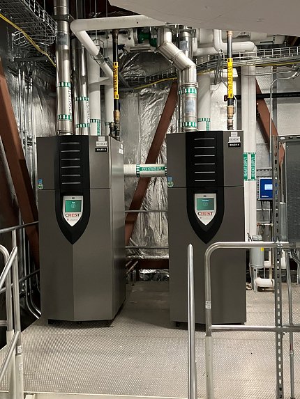 Two large, rectangular boxes with multiple pipes coming off the tops.