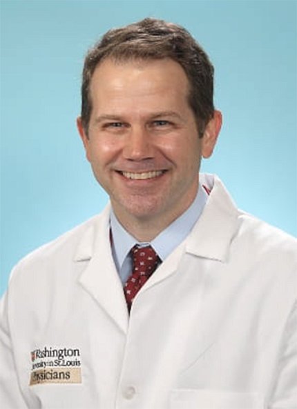 Dr. Mark Huffman in lab coat