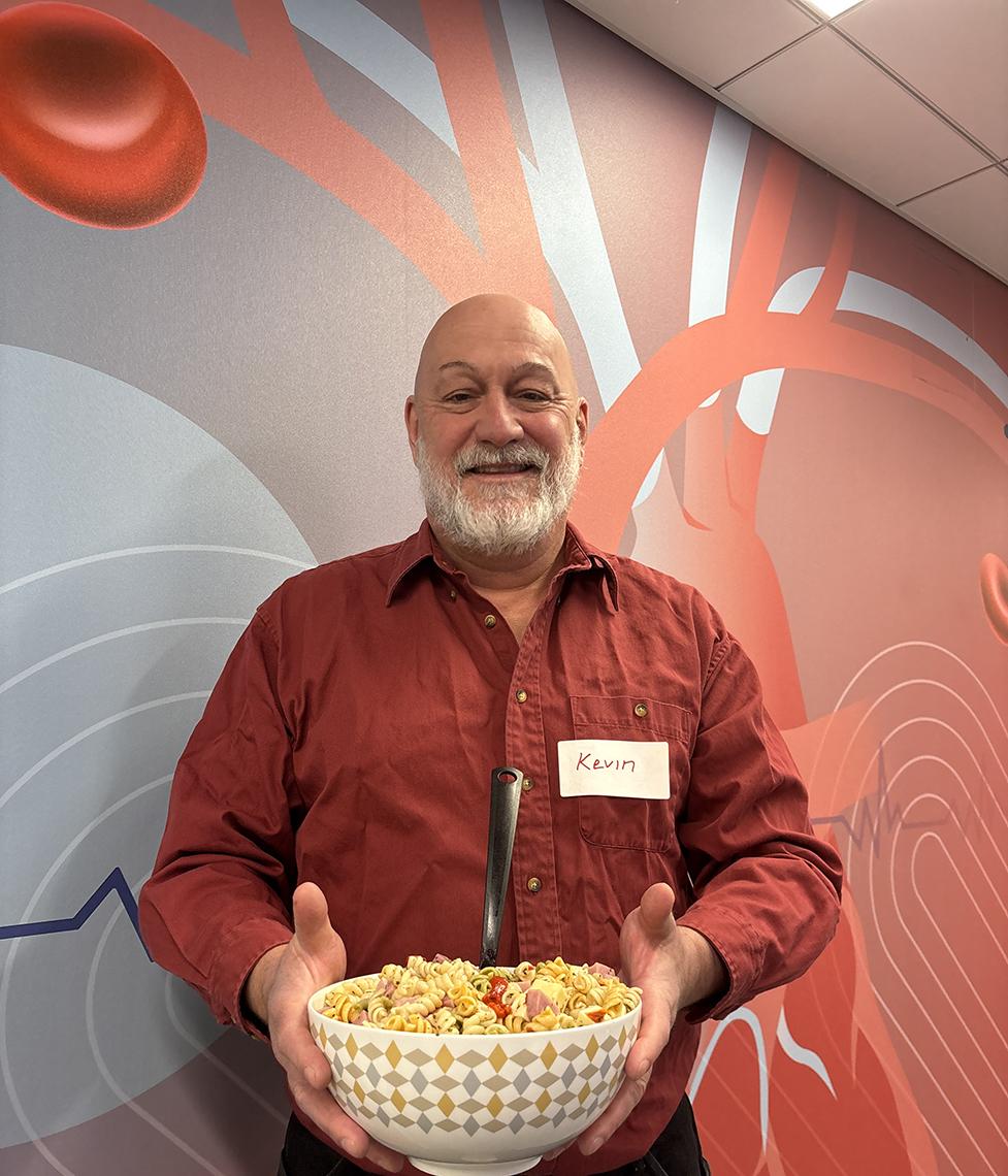 Purkisar holding bowl of salad
