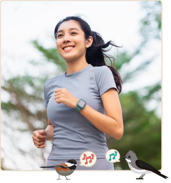 A woman jogs with a smile on her face