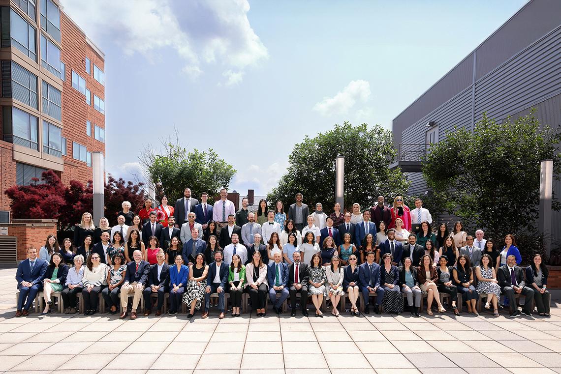 The graduating class of fellows on a Clinical Center patio